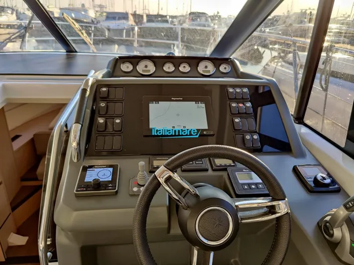  Yacht Photos Pics Cockpit of 2020 Jeanneau Leader 36 yacht with navigation controls and steering wheel.