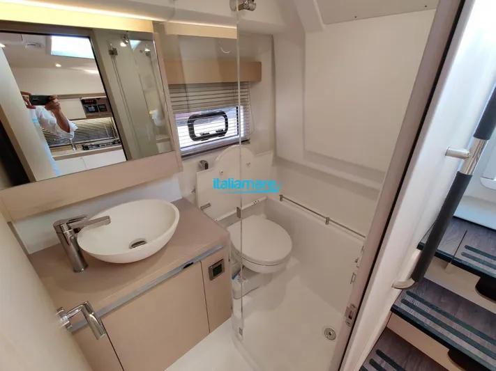  Yacht Photos Pics Modern bathroom interior on 2020 Jeanneau Leader 36 yacht, featuring sink and toilet.