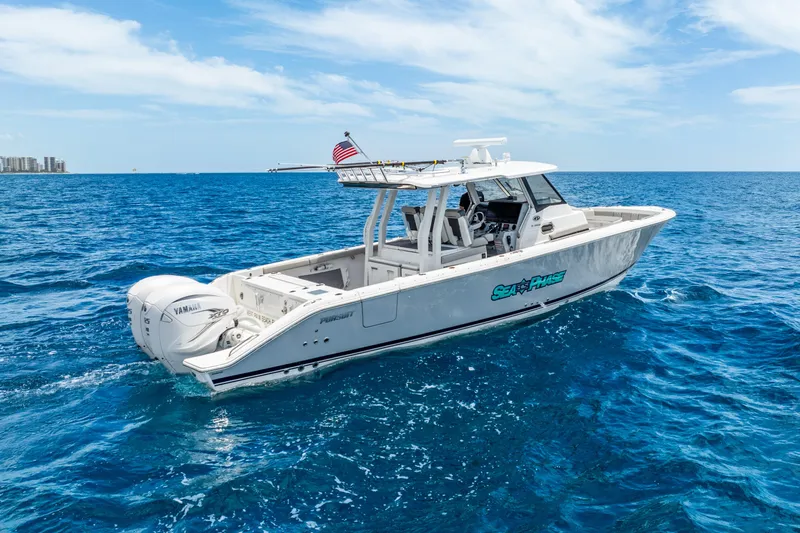 Sea Phase Yacht Photos Pics 2024 Pursuit S 358 Sport boat cruising on open blue ocean waters.