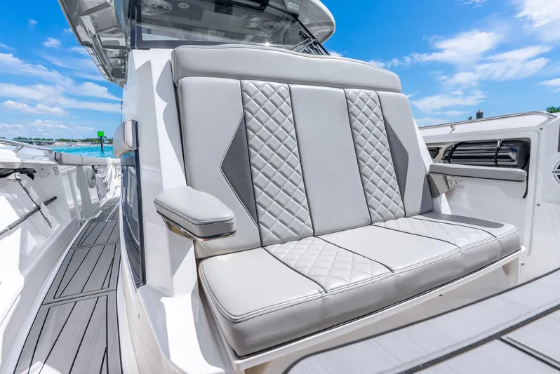 Sea Phase Yacht Photos Pics 2024 Pursuit S 358 Sport boat with luxurious seating and sleek design.