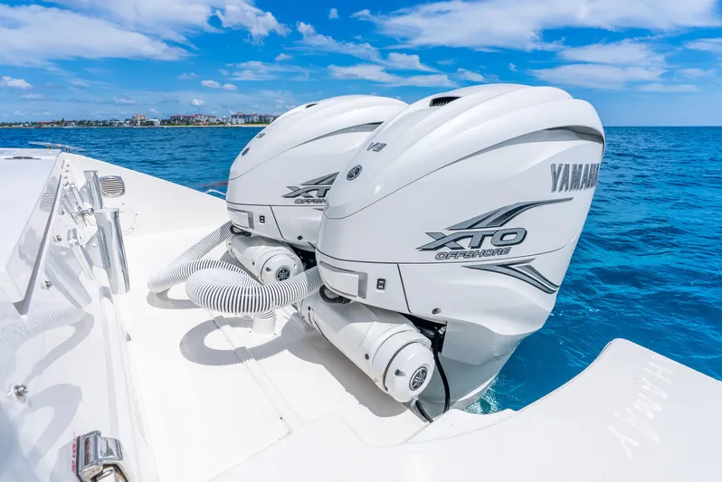 Sea Phase Yacht Photos Pics 2024 Pursuit S 358 Sport boat with Yamaha XTO Offshore engines on blue ocean.