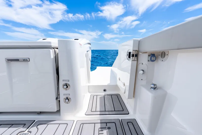 Sea Phase Yacht Photos Pics 2024 Pursuit S 358 Sport boat deck with ocean view and blue sky.