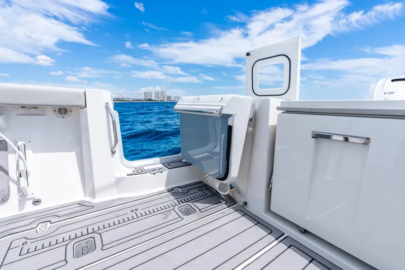 Sea Phase Yacht Photos Pics 2024 Pursuit S 358 Sport boat interior with ocean view, featuring sleek design and modern amenities.