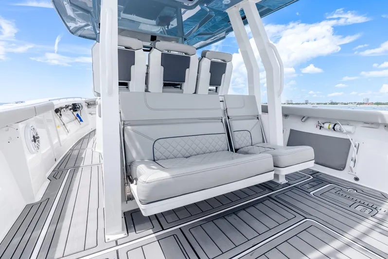 Sea Phase Yacht Photos Pics 2024 Pursuit S 358 Sport boat interior with luxurious seating and sleek design.