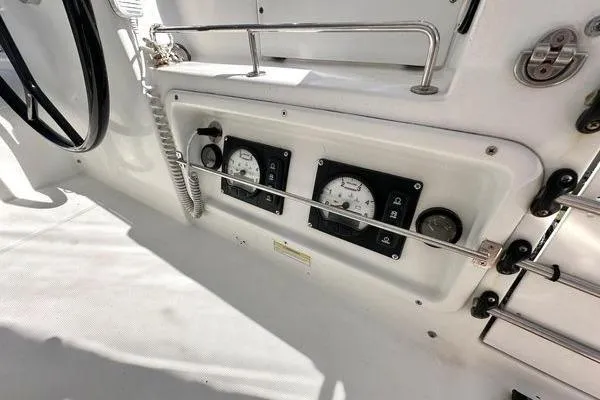 Brizo Yacht Photos Pics Control panel of a 2006 Lagoon 440 catamaran with gauges and steering wheel.
