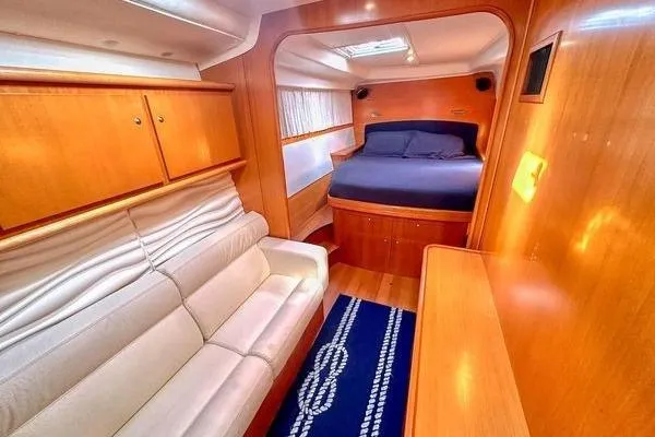 Brizo Yacht Photos Pics Luxurious interior of 2006 Lagoon 440 yacht with cozy bed and elegant seating area.