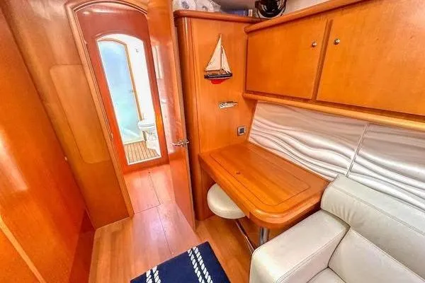 Brizo Yacht Photos Pics Interior of 2006 Lagoon 440 yacht with wooden cabinetry and seating area.