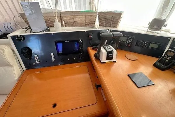 Brizo Yacht Photos Pics Control panel of a 2006 Lagoon 440 catamaran with navigation equipment and communication devices.