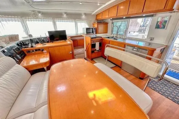 Brizo Yacht Photos Pics Interior of 2006 Lagoon 440 yacht with modern kitchen and dining area.