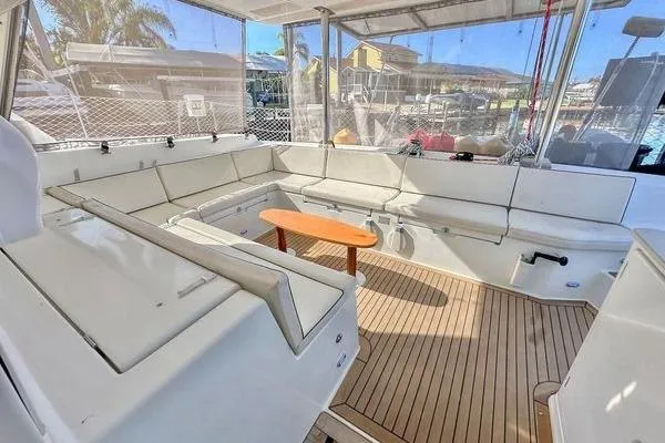 Brizo Yacht Photos Pics Spacious deck of 2006 Lagoon 440 catamaran with comfortable seating and wooden table.