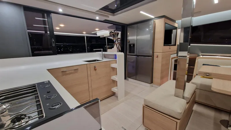  Yacht Photos Pics Modern kitchen interior of 2026 Aventura 45 yacht with sleek design and appliances.