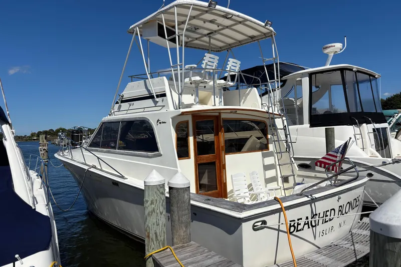 Yacht Photos Pics 1985 Egg Harbor 37 Tournament yacht docked, featuring a spacious deck and flybridge.