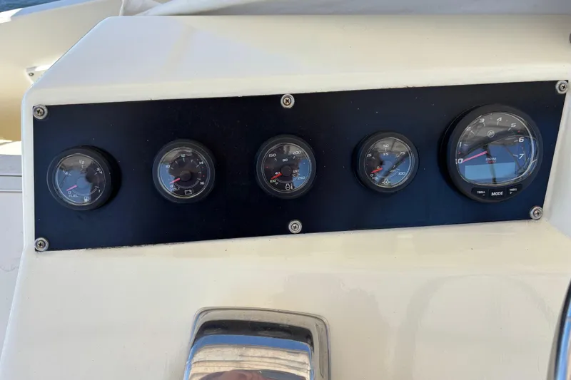  Yacht Photos Pics Instrument panel of a 1985 Egg Harbor 37 Tournament boat, featuring various gauges.