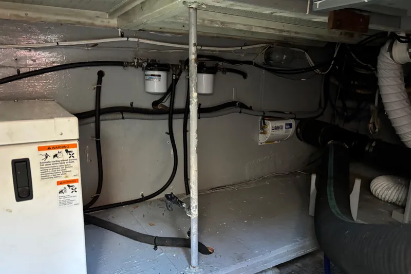  Yacht Photos Pics Engine room of 1985 Egg Harbor 37 Tournament boat, showing wiring and equipment.