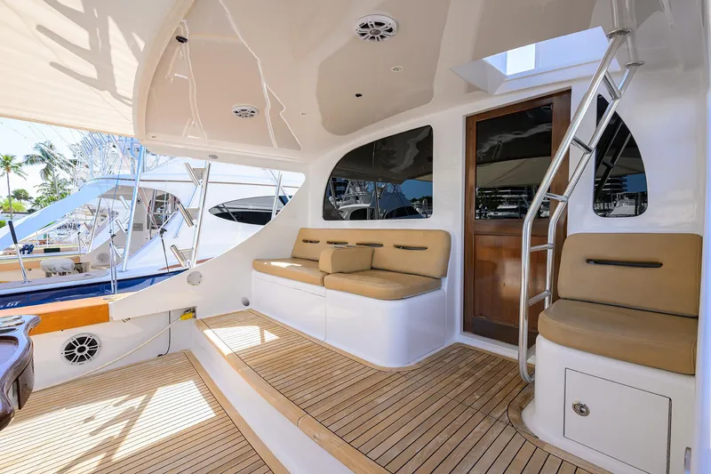  Yacht Photos Pics Luxurious 2006 Blackwell Custom Carolina yacht interior with cushioned seating and wooden flooring.