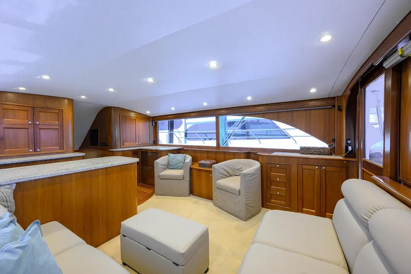  Yacht Photos Pics Luxurious interior of 2006 Blackwell Custom Carolina yacht with elegant wood finishes and plush seating.