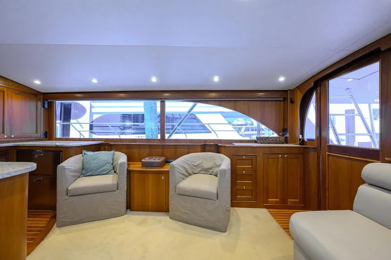  Yacht Photos Pics Luxurious interior of 2006 Blackwell Custom Carolina yacht with plush seating and wooden cabinetry.