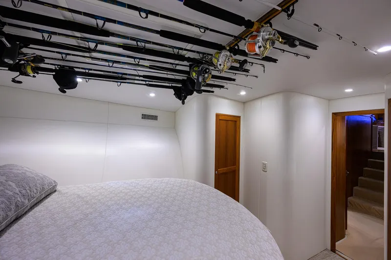  Yacht Photos Pics Bedroom interior of 2006 Blackwell Custom Carolina boat with fishing rods on ceiling.