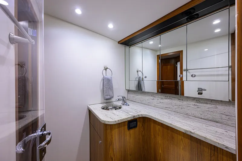  Yacht Photos Pics Luxurious bathroom in 2006 Blackwell Custom Carolina yacht with modern fixtures and wooden cabinetry.