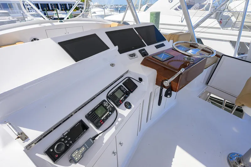  Yacht Photos Pics Helm of 2006 Blackwell Custom Carolina boat with navigation equipment and steering wheel.