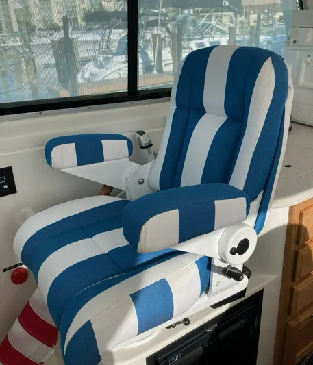  Yacht Photos Pics Striped captain's chair on a 2009 Back Cove 33 yacht.