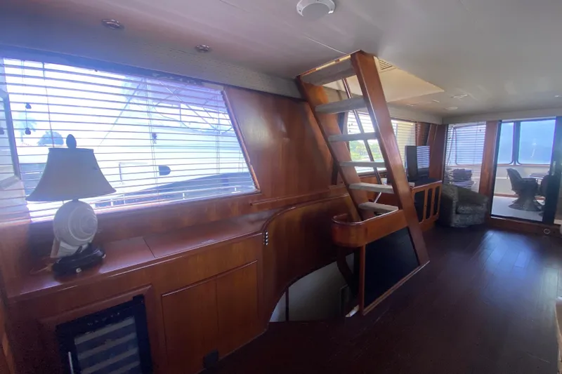 Sea Sharp Yacht Photos Pics Interior of 1990 Viking 63 Motor Yacht with wooden finishes and modern furnishings.