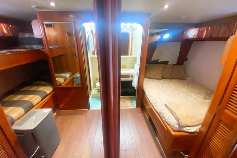 Sea Sharp Yacht Photos Pics Luxurious interior of 1990 Viking 63 Motor Yacht with cozy sleeping quarters.