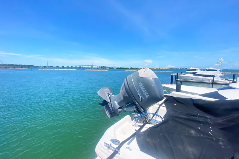 Sea Sharp Yacht Photos Pics 1990 Viking 63 Motor Yacht docked with Yamaha outboard, scenic waterfront view.