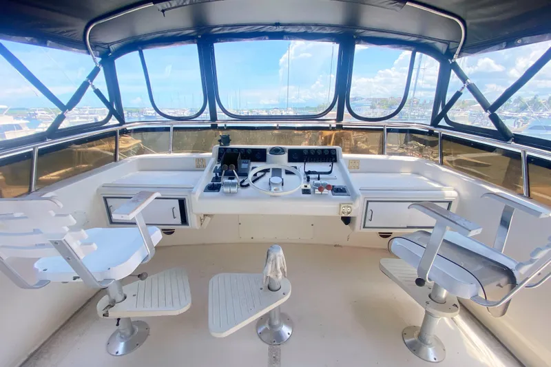 Sea Sharp Yacht Photos Pics 1990 Viking 63 Motor Yacht helm with dual seats and panoramic windows.