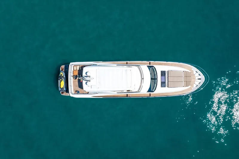 Oceana Yacht Photos Pics Aerial view of 2015 Prestige 750 yacht on clear blue water.