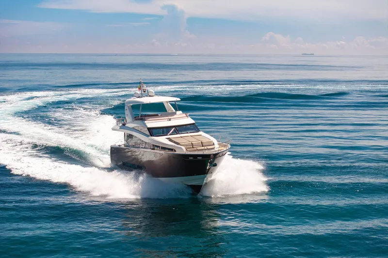 Oceana Yacht Photos Pics Luxury 2015 Prestige 750 yacht cruising on open sea under clear skies.