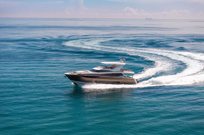 Oceana Yacht Photos Pics Luxurious 2015 Prestige 750 yacht cruising on open sea, creating elegant water trails.
