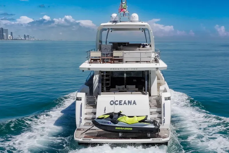 Oceana Yacht Photos Pics Luxury yacht Prestige 750 cruising with jet ski, ocean view, 2015 model.