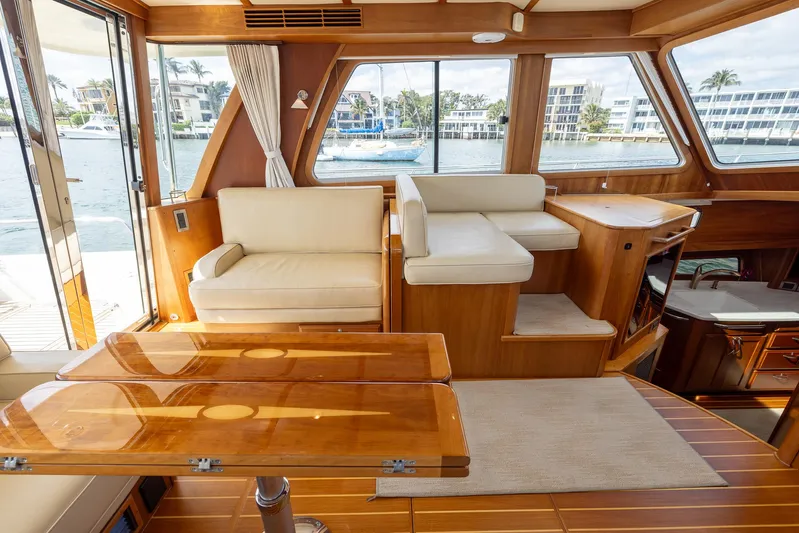Pinch Me Yacht Photos Pics Interior of 2015 Sabre 48 Salon Express yacht with elegant seating and wooden finishes.