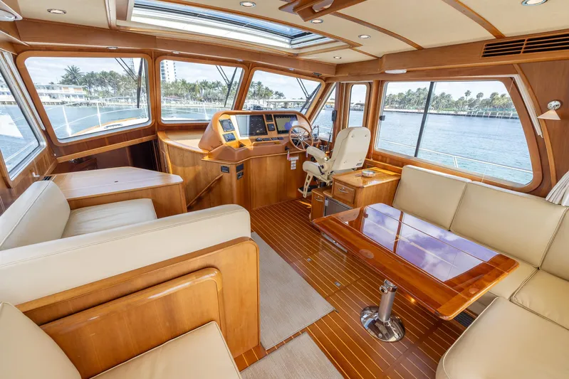 Pinch Me Yacht Photos Pics Luxurious interior of 2015 Sabre 48 Salon Express yacht with elegant wood finishes.