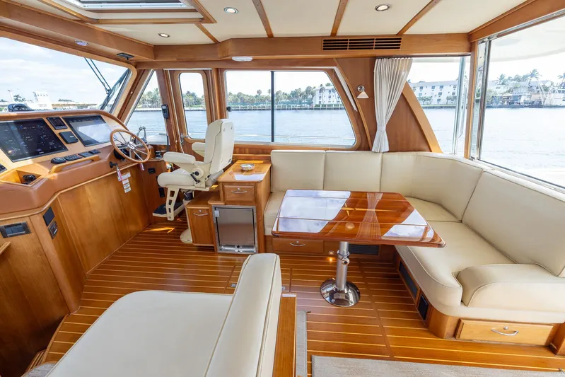 Pinch Me Yacht Photos Pics Interior of 2015 Sabre 48 Salon Express yacht with elegant wood finish and spacious seating.