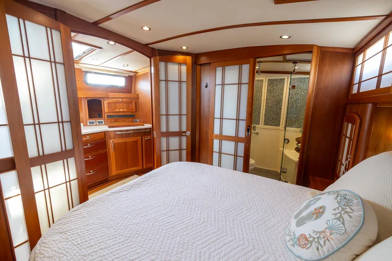 Pinch Me Yacht Photos Pics Luxurious 2015 Sabre 48 Salon Express yacht interior with wood paneling and elegant bedroom.