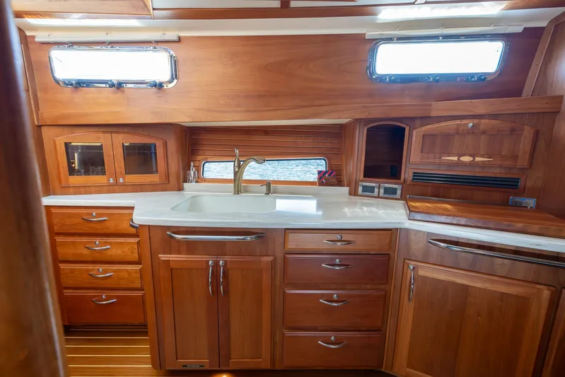 Pinch Me Yacht Photos Pics Luxurious wooden kitchen interior of 2015 Sabre 48 Salon Express yacht.