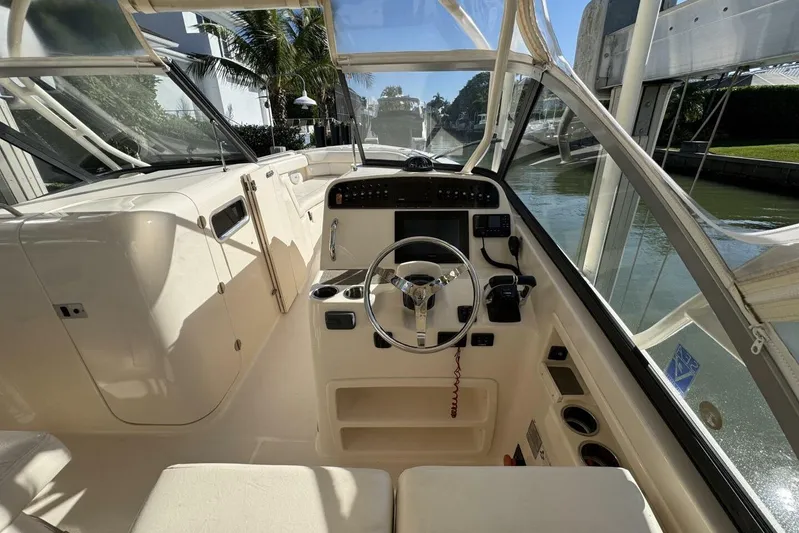  Yacht Photos Pics 2016 Grady-White Freedom 307 boat interior with steering wheel and control panel.