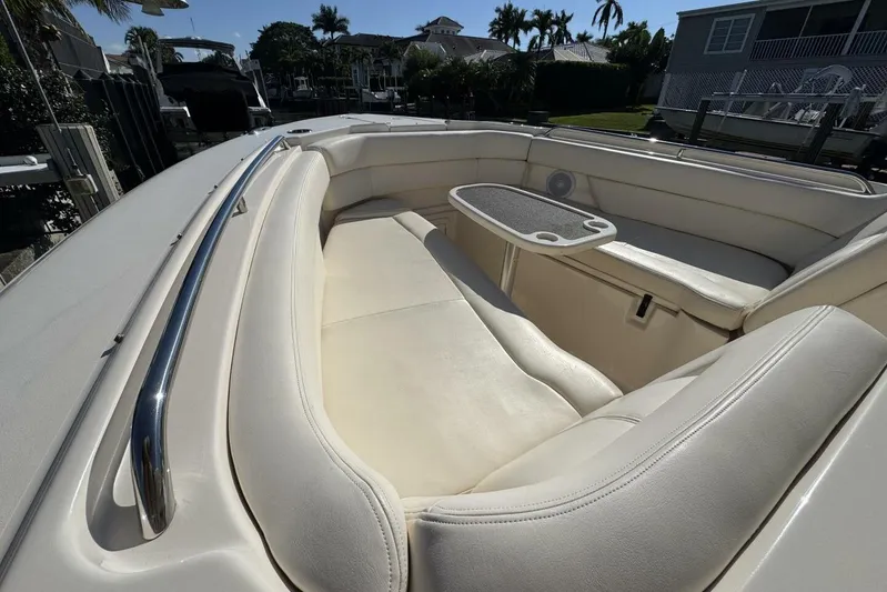  Yacht Photos Pics 2016 Grady-White Freedom 307 boat interior with white seating and table.