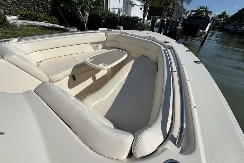  Yacht Photos Pics 2016 Grady-White Freedom 307 boat interior with cushioned seating and table.