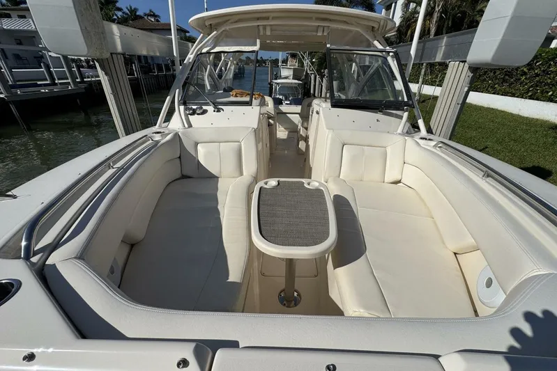  Yacht Photos Pics 2016 Grady-White Freedom 307 boat interior with white seating and table.