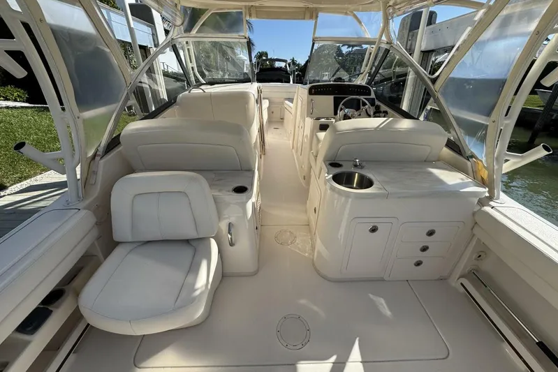  Yacht Photos Pics 2016 Grady-White Freedom 307 boat interior with seating and helm station.