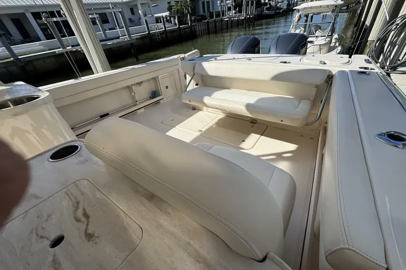 Yacht Photos Pics 2016 Grady-White Freedom 307 boat interior with beige seating and cup holders.