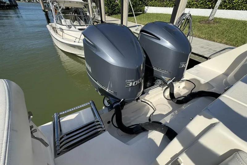  Yacht Photos Pics 2016 Grady-White Freedom 307 with twin Yamaha 300 engines docked by the water.
