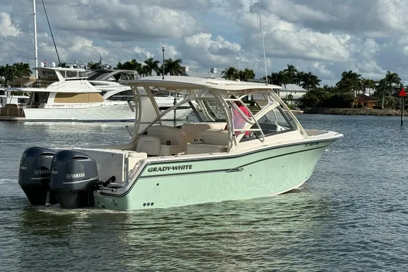  Yacht Photos Pics 2016 Grady-White Freedom 307 boat with twin Yamaha engines on calm water.