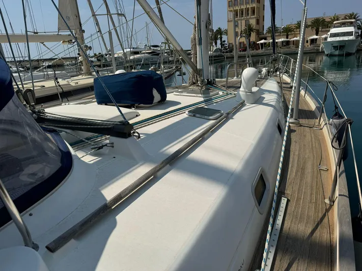  Yacht Photos Pics 2004 Beneteau 50 sailboat docked in marina, showcasing deck and rigging.