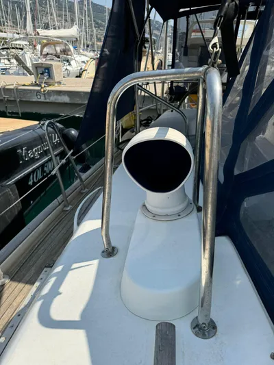  Yacht Photos Pics Beneteau 50 sailboat deck, 2004 model, featuring a ventilation system and marina background.