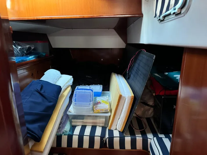  Yacht Photos Pics Interior cabin of a 2004 Beneteau 50 yacht with storage items.