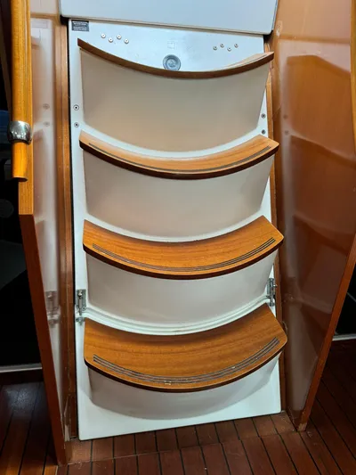  Yacht Photos Pics Wooden steps inside a 2004 Beneteau 50 yacht, showcasing elegant marine design.